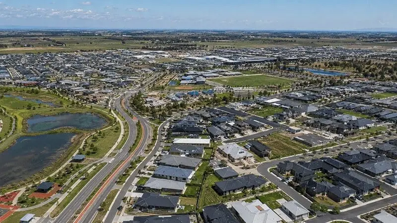Aerial view of a residential suburb in Melbourne, Australia, showcasing homes vulnerable to winter pests