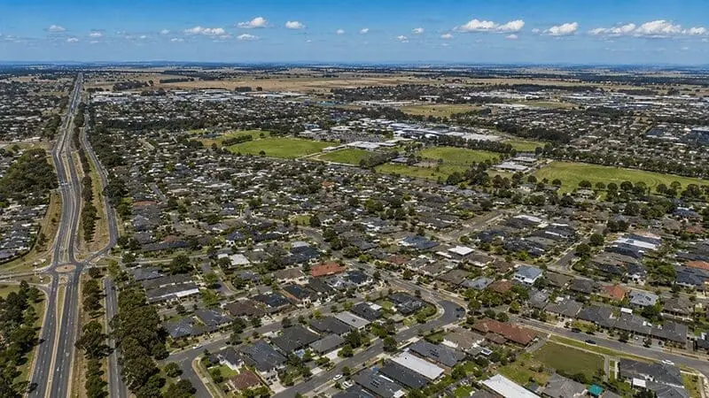 Aerial view of residential Melbourne suburbs, showcasing homes vulnerable to winter pests like rodents
